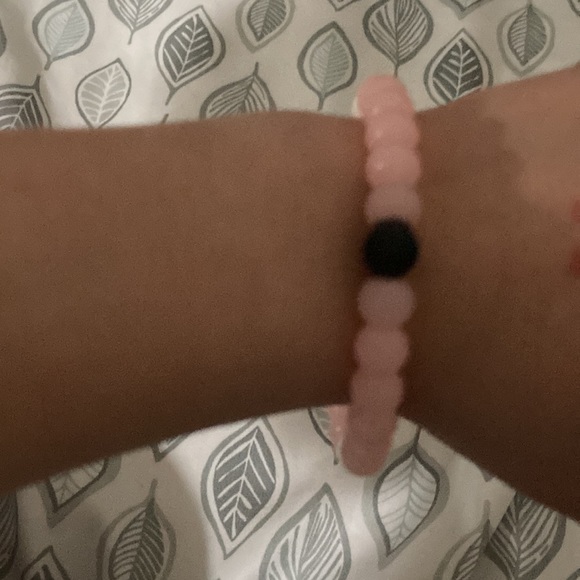 A pink and white and black bracelet - Picture 2 of 2